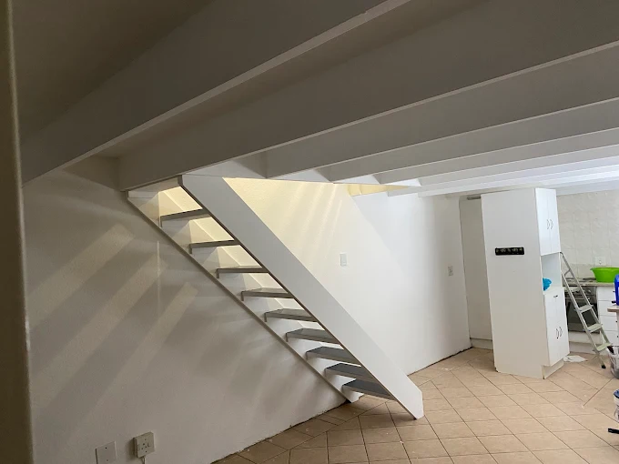 Illustrative painted under-stair area